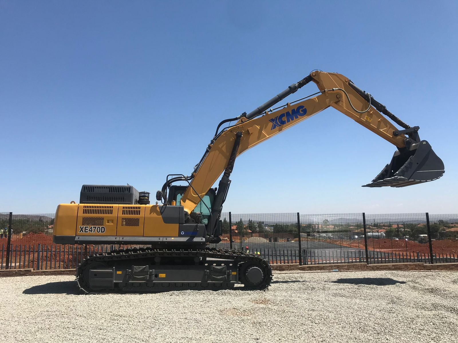 Yellow excavator on a work site